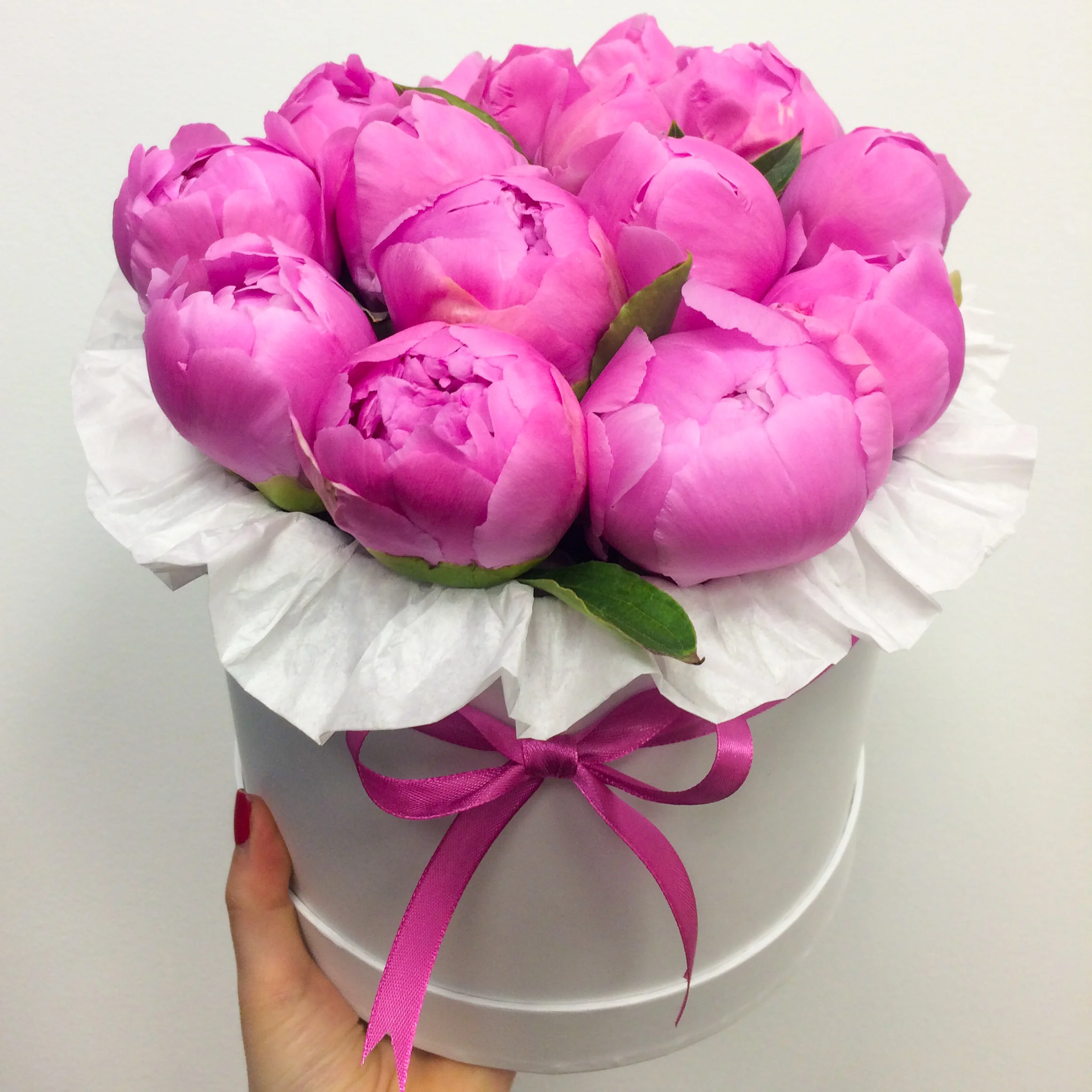Box of pink peonies