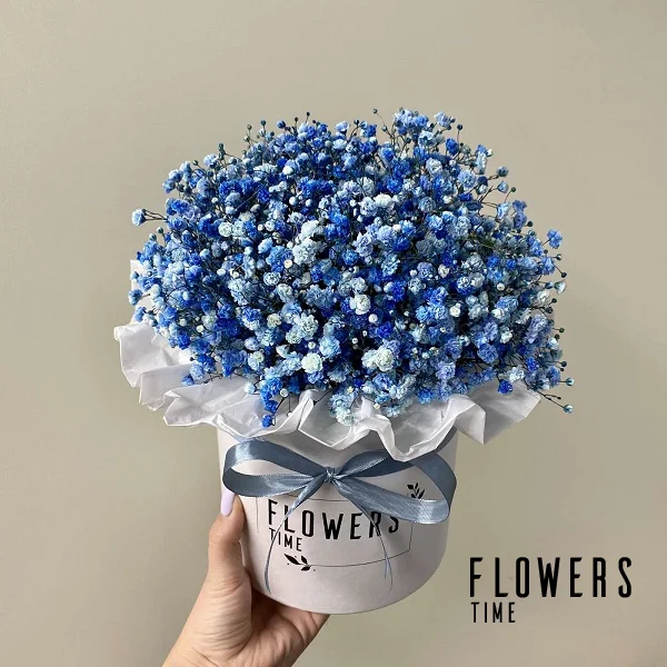 A box of blue baby's breath flowers